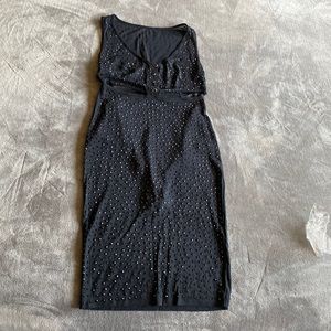This is a black see through dress, it doesn’t have a tag but it fits size small.